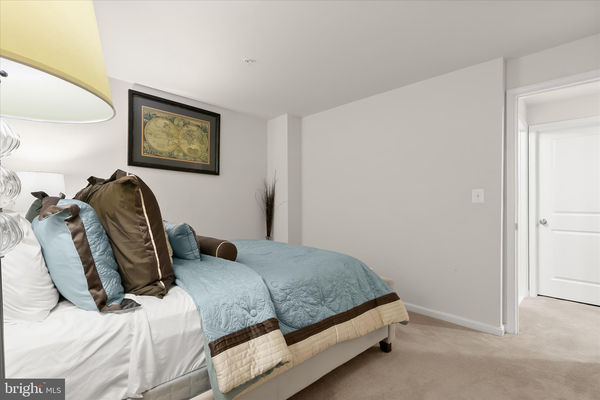 13502 Windy Meadow Lane Silver Spring, MD 20906 - Photo 60 of 74 a bedroom with a bed and a painting on the wall