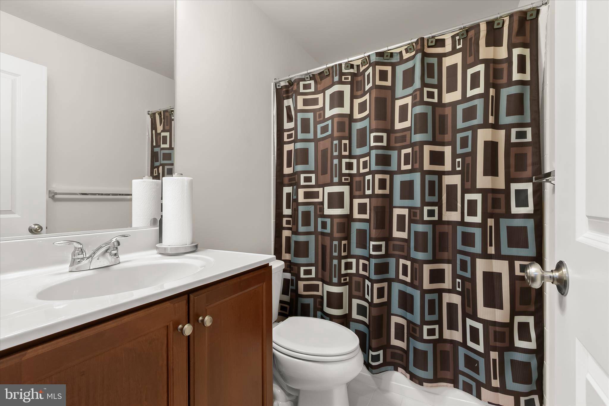 13502 Windy Meadow Lane Silver Spring, MD 20906 - Photo 61 of 74 a bathroom with a sink toilet and shower