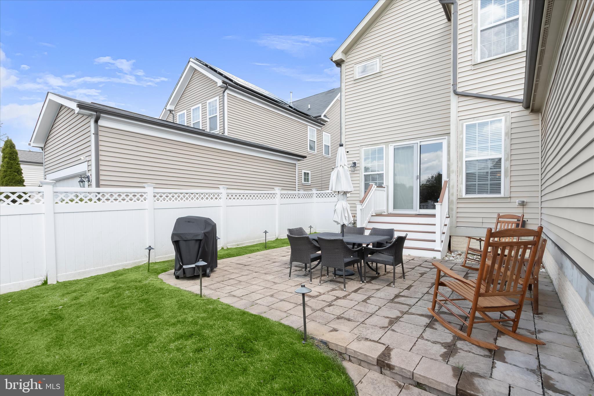 13502 Windy Meadow Lane Silver Spring, MD 20906 - Photo 7 of 74 a view of a house with patio and a yard