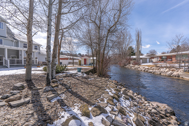 1045 Fox Farm Road Logan, UT 84321 - Photo 6 of 65 View of yard with a residential view, a water view, and an outbuilding