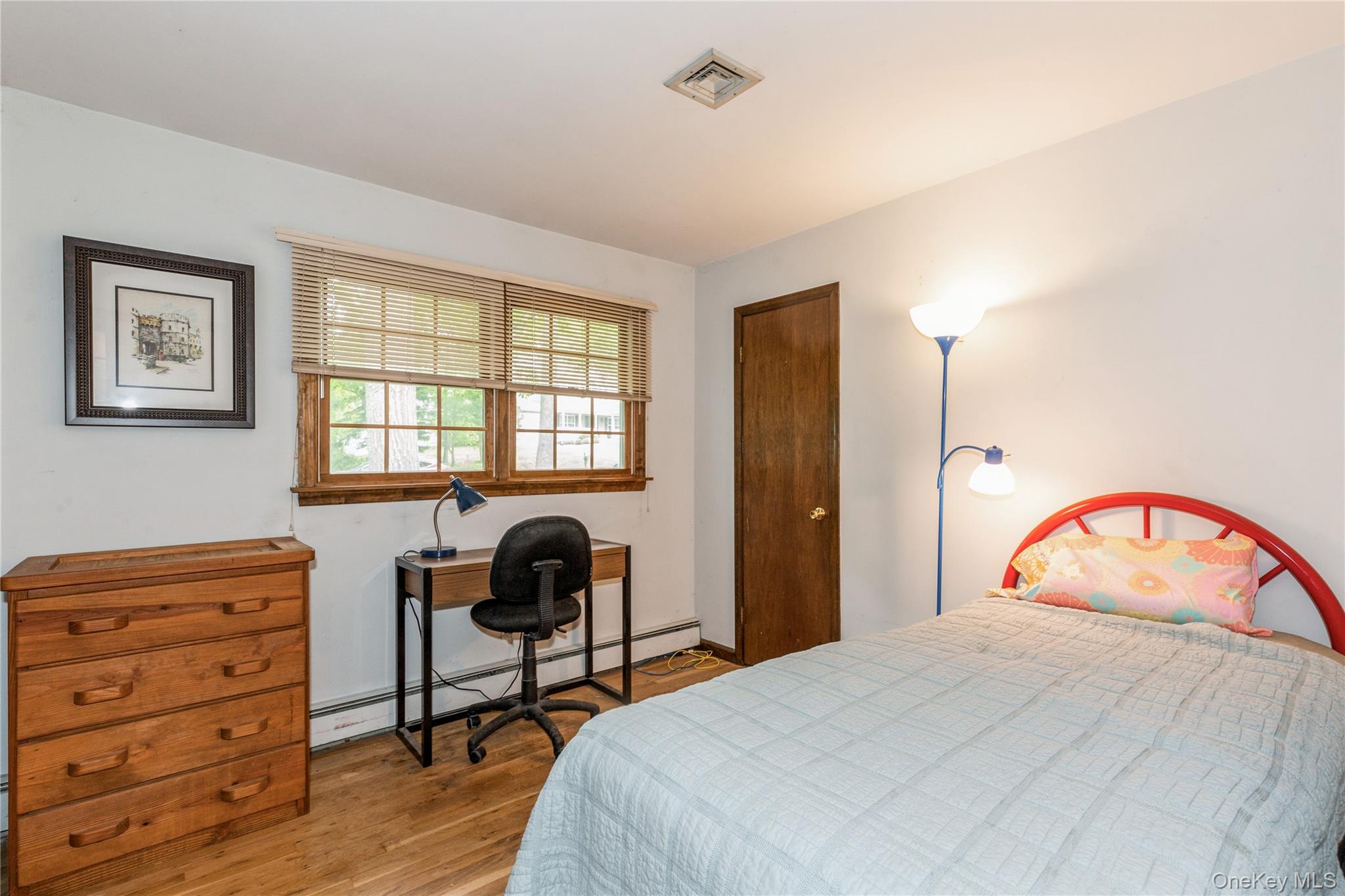 32 Lower Cross Shoreham, NY 11786 - Photo 14 of 20 a bedroom with a bed and a window