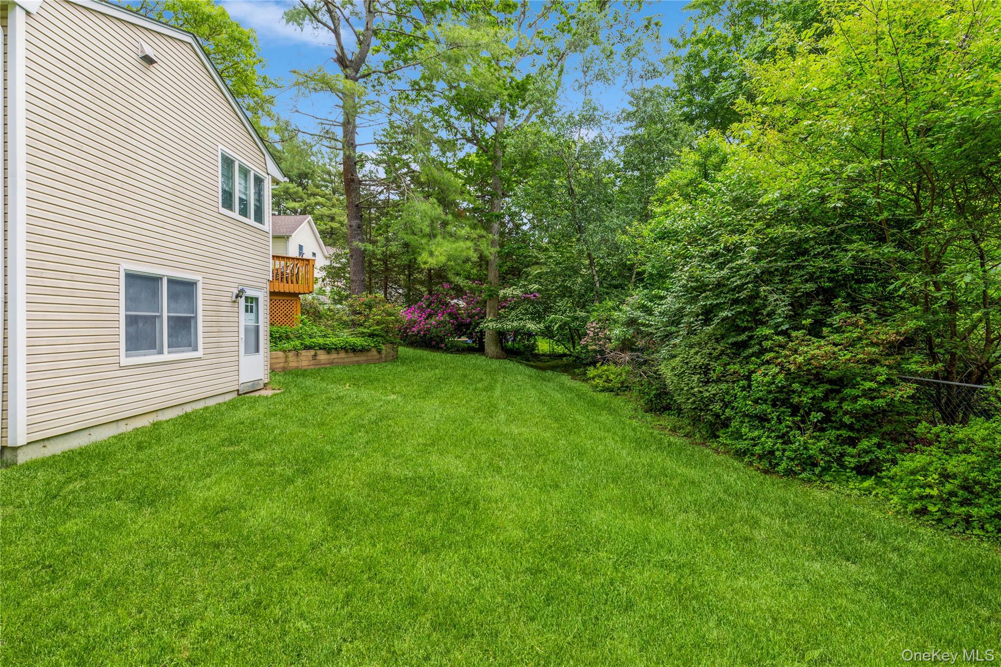 32 Lower Cross Shoreham, NY 11786 - Photo 18 of 20 a view of a house with a backyard