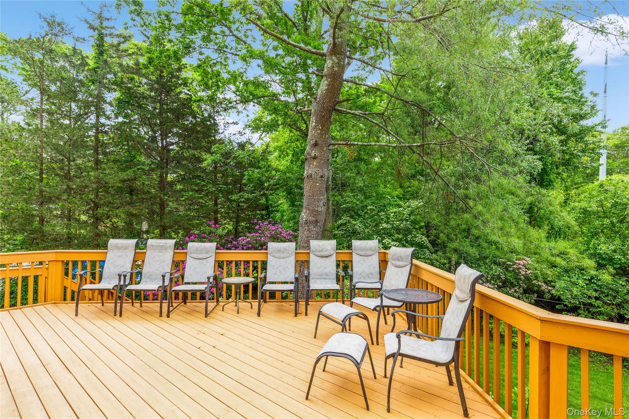 32 Lower Cross Shoreham, NY 11786 - Photo 19 of 20 a view of a patio with dining table and chairs with wooden floor
