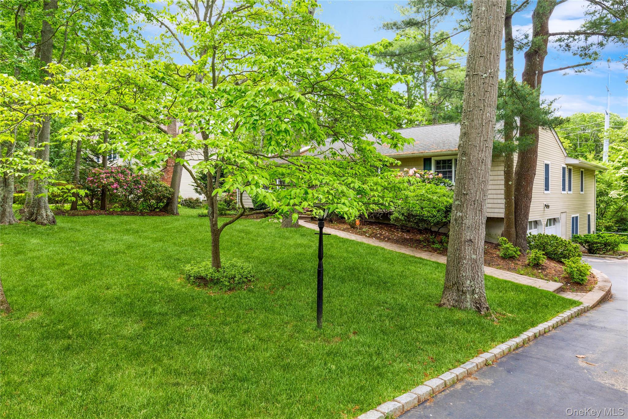 32 Lower Cross Shoreham, NY 11786 - Photo 2 of 20 a view of a garden with a tree