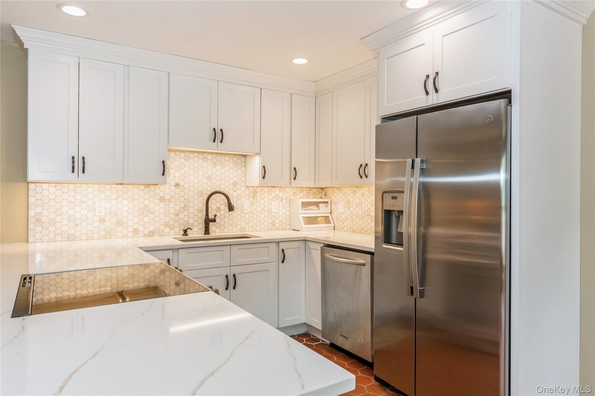 32 Lower Cross Shoreham, NY 11786 - Photo 3 of 20 a kitchen with a sink stainless steel appliances and cabinets