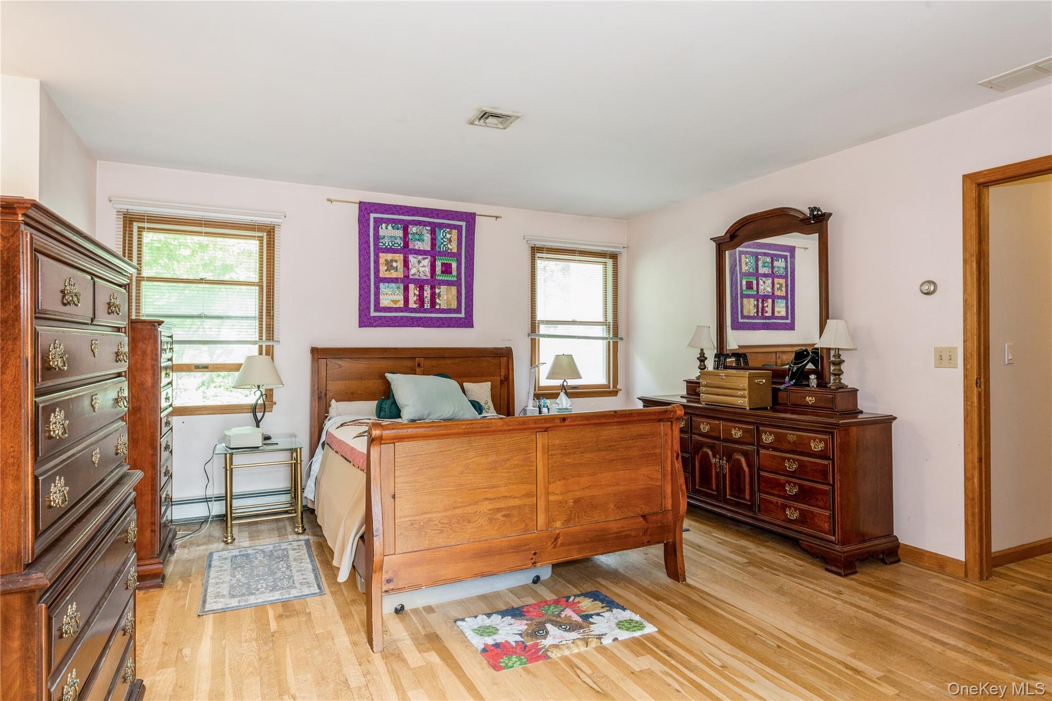 32 Lower Cross Shoreham, NY 11786 - Photo 8 of 20 a bed room with a bed and a dresser