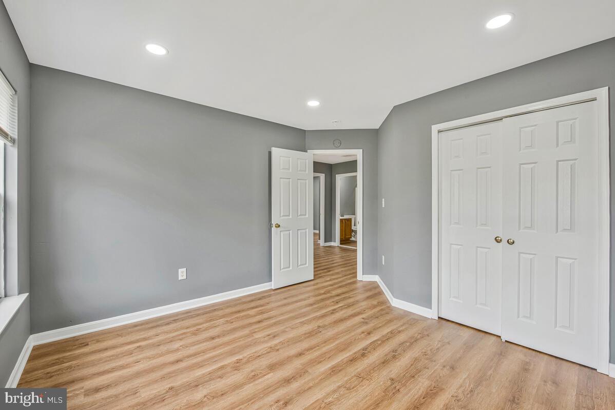 1329 Canberra Drive Baltimore, MD 21221 - Photo 20 of 43 a view of an empty room with wooden floor
