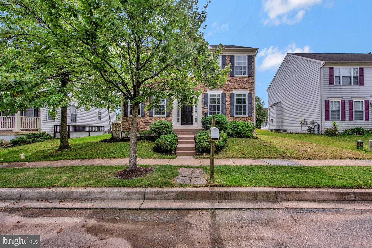 1329 Canberra Drive Baltimore, MD 21221 - Photo 2 of 43 a front view of house with yard and green space