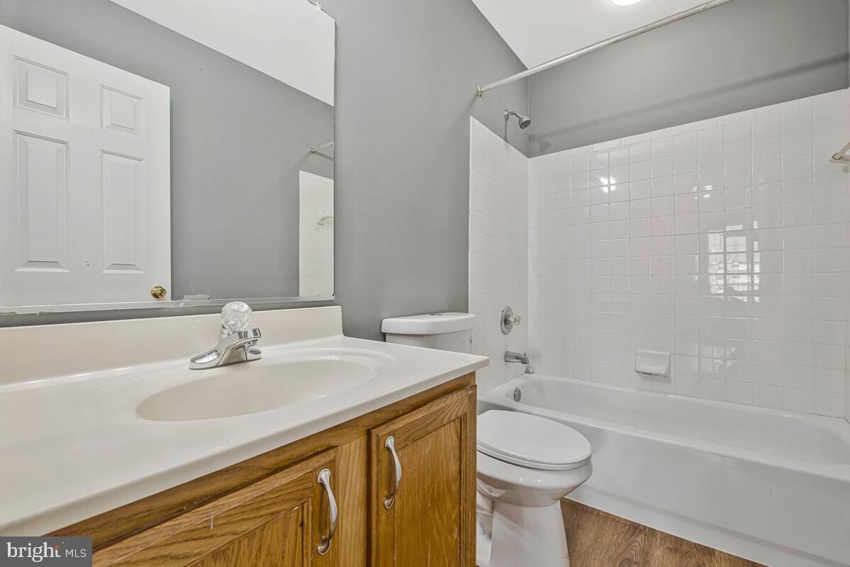 1329 Canberra Drive Baltimore, MD 21221 - Photo 25 of 43 a bathroom with a sink a toilet and shower