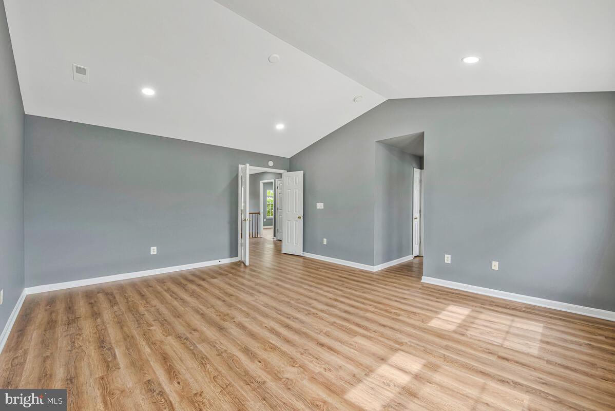 1329 Canberra Drive Baltimore, MD 21221 - Photo 27 of 43 a view of an empty room with wooden floor
