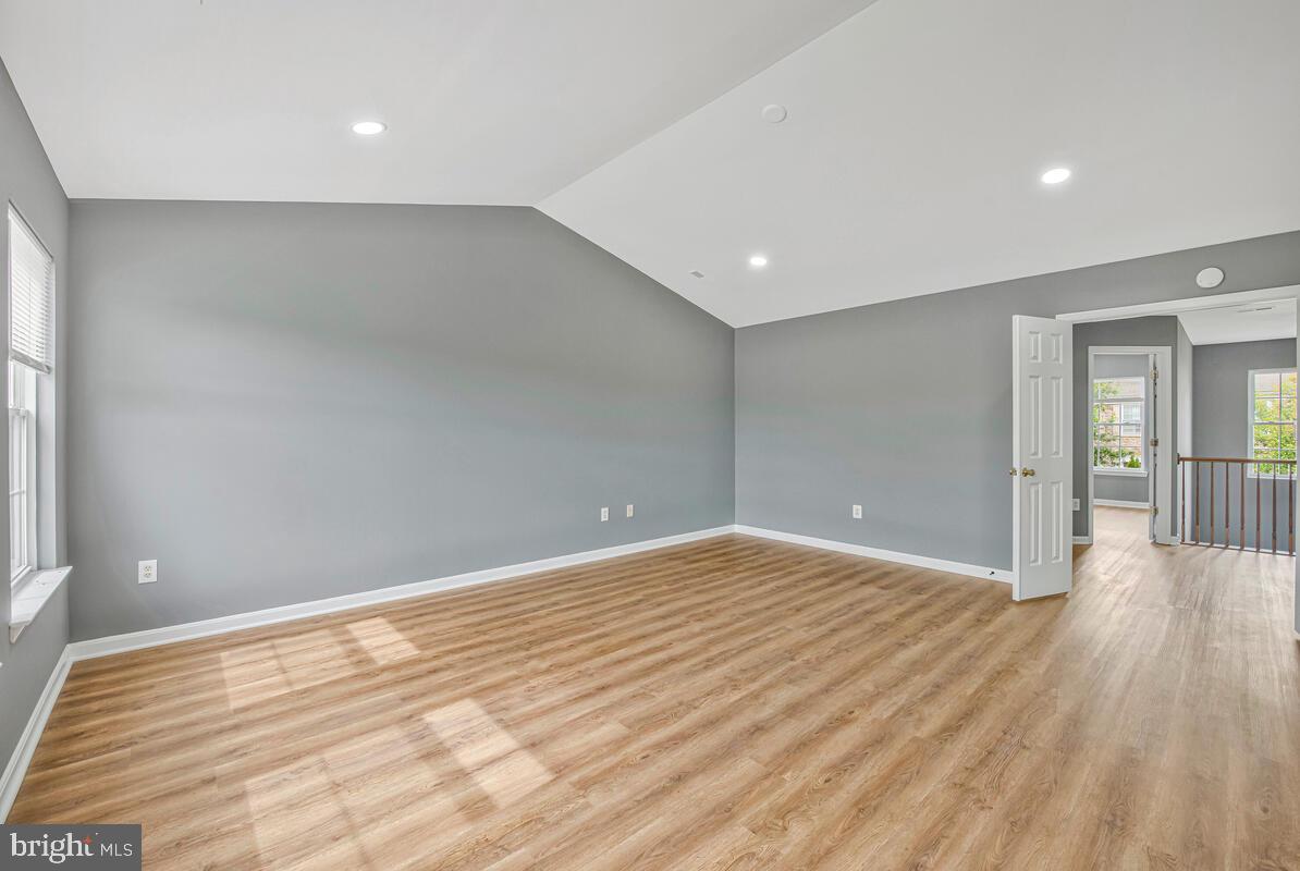 1329 Canberra Drive Baltimore, MD 21221 - Photo 28 of 43 a view of an empty room with wooden floor and a window