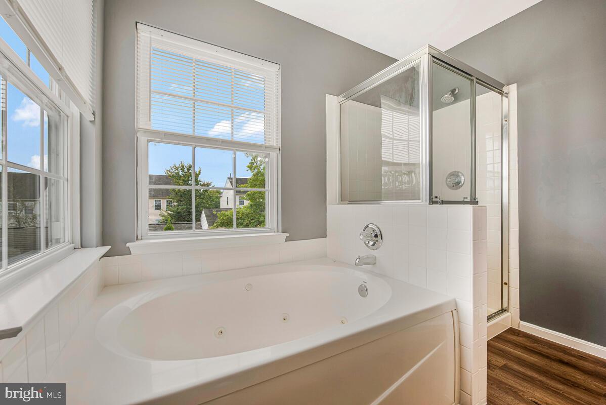 1329 Canberra Drive Baltimore, MD 21221 - Photo 30 of 43 a bathroom with a bathtub and a shower