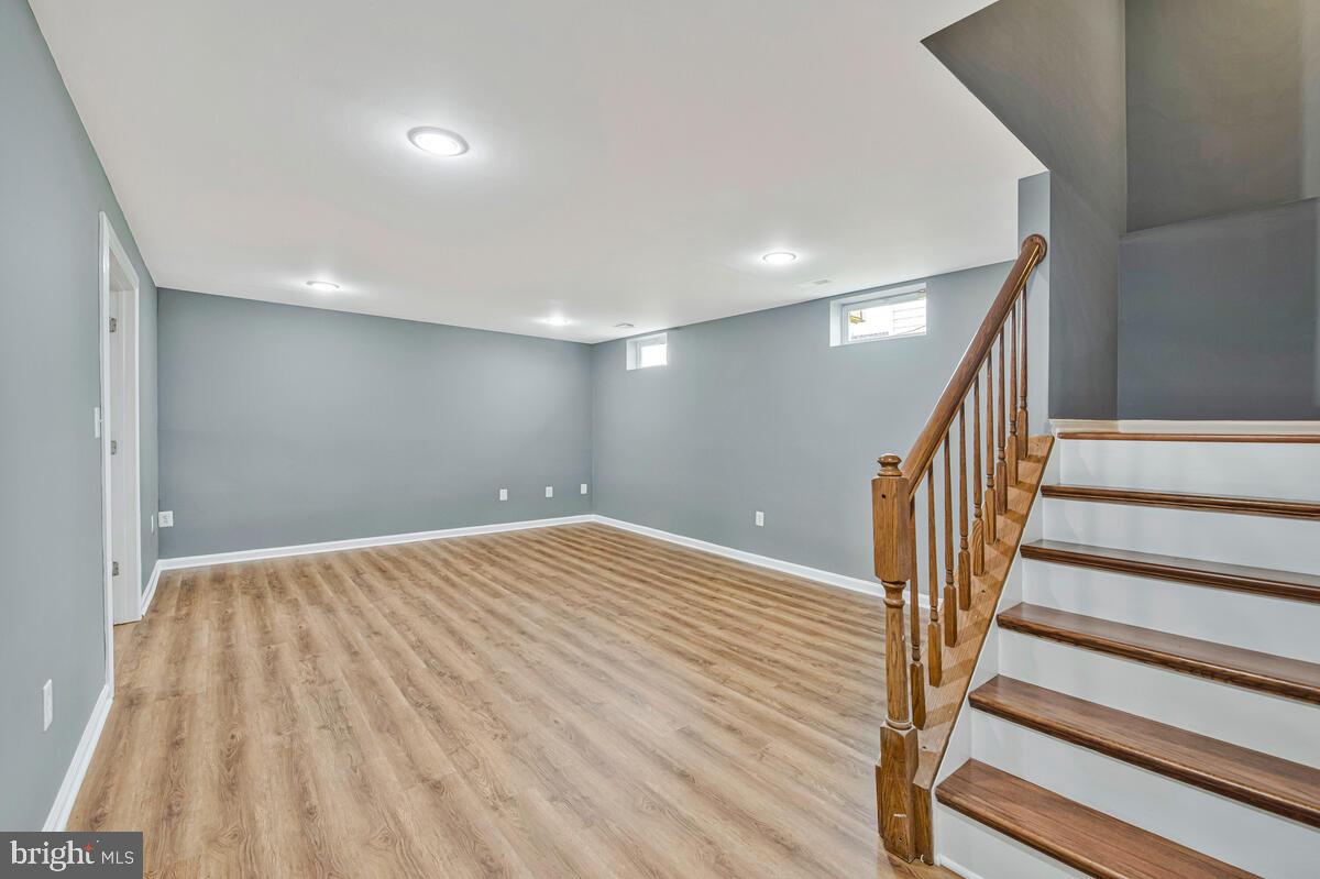 1329 Canberra Drive Baltimore, MD 21221 - Photo 32 of 43 a view of empty room with wooden floor
