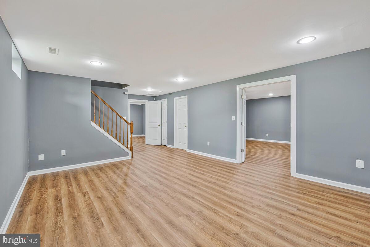 1329 Canberra Drive Baltimore, MD 21221 - Photo 33 of 43 a view of an empty room with wooden floor