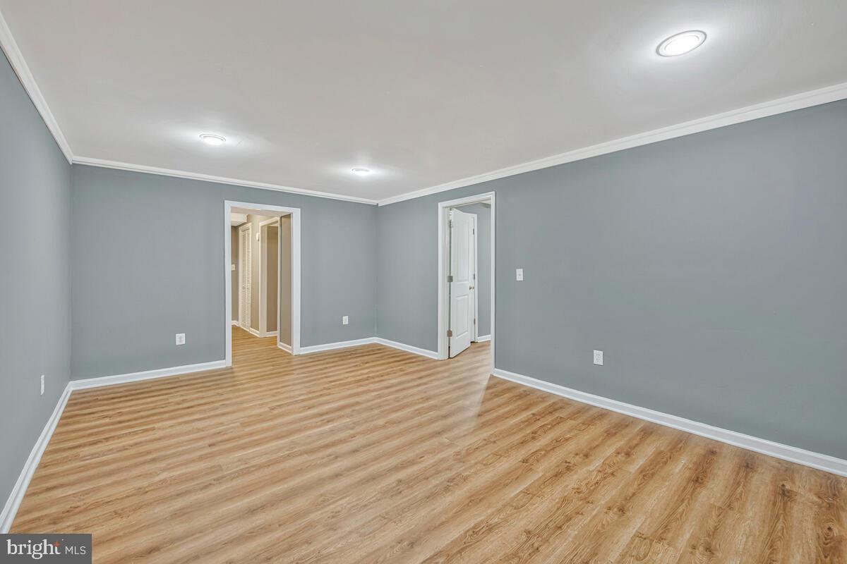 1329 Canberra Drive Baltimore, MD 21221 - Photo 34 of 43 a view of an empty room with wooden floor