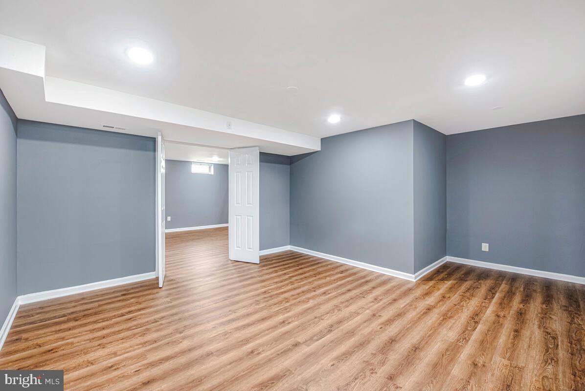 1329 Canberra Drive Baltimore, MD 21221 - Photo 36 of 43 a view of an empty room with wooden floor