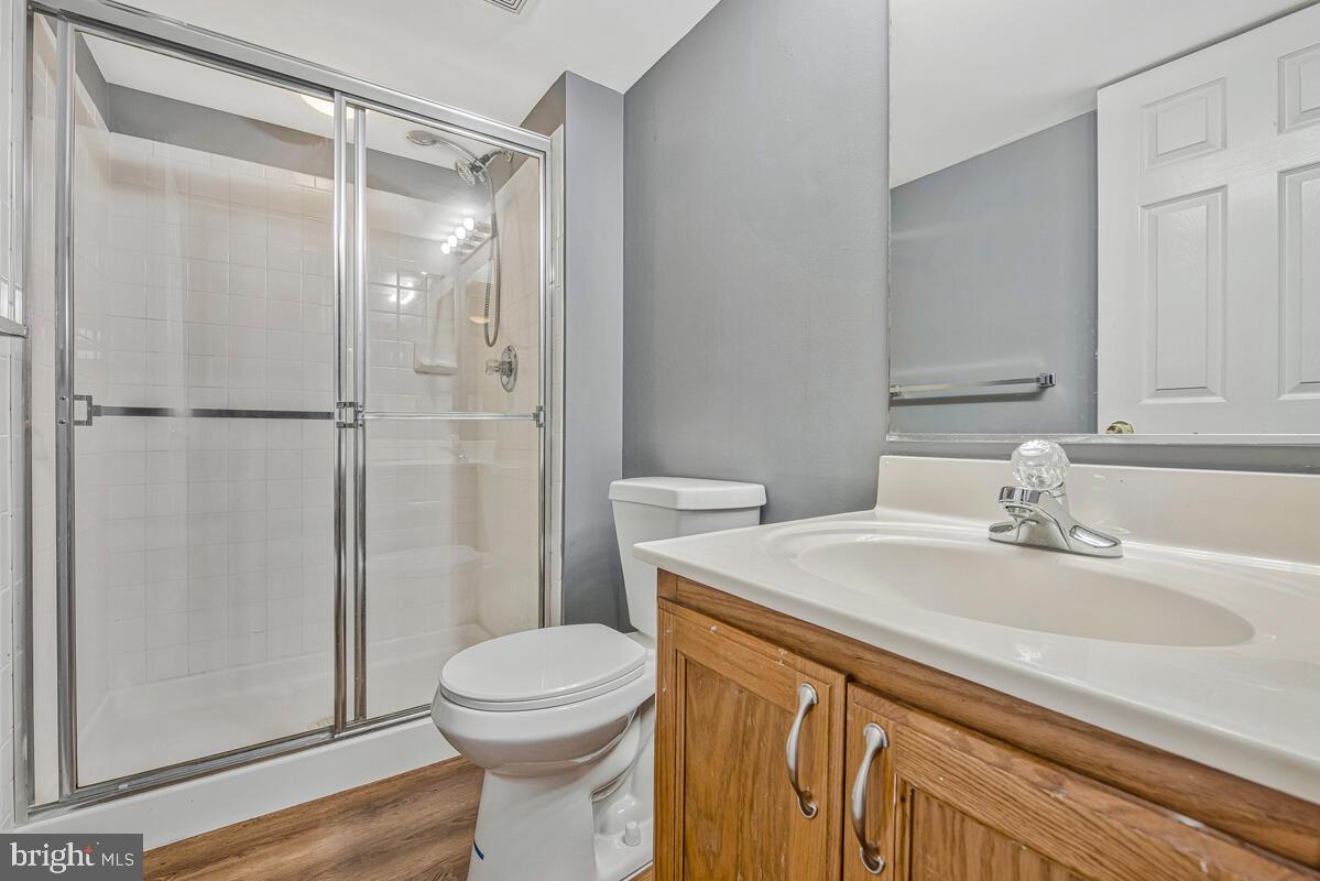1329 Canberra Drive Baltimore, MD 21221 - Photo 37 of 43 a bathroom with a sink a toilet and shower