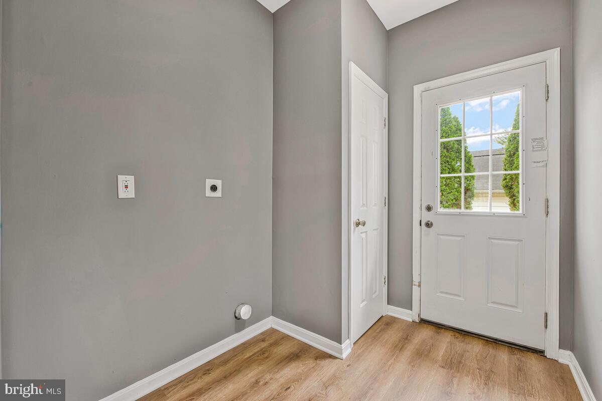 1329 Canberra Drive Baltimore, MD 21221 - Photo 38 of 43 a view of room with hardwood floor and window