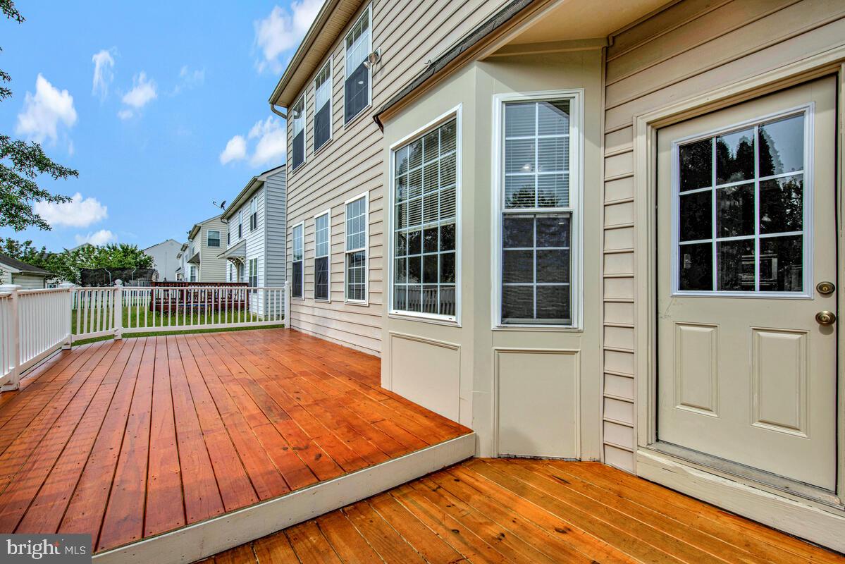 1329 Canberra Drive Baltimore, MD 21221 - Photo 39 of 43 a view of outdoor space and deck with wooden floor and fence