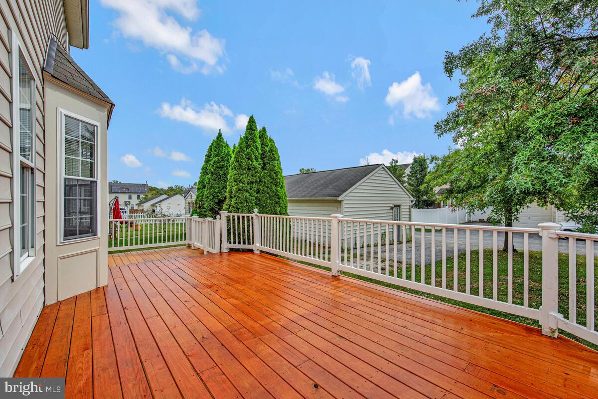 1329 Canberra Drive Baltimore, MD 21221 - Photo 40 of 43 a view of backyard with a deck and wooden floor