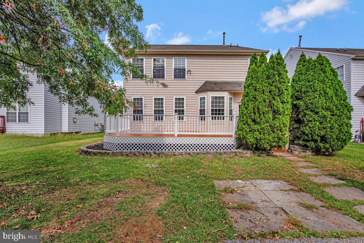 1329 Canberra Drive Baltimore, MD 21221 - Photo 41 of 43 a front view of a house with a garden