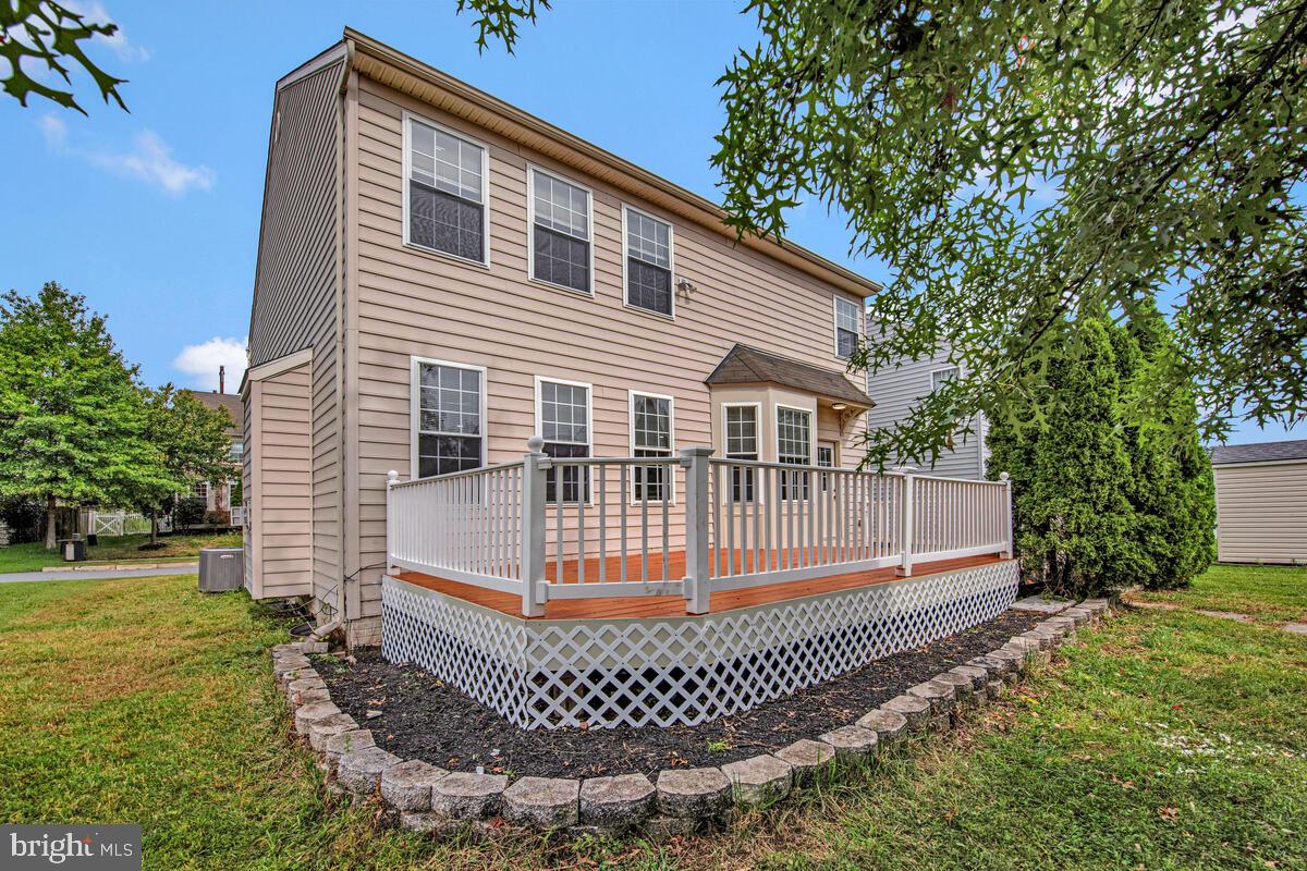 1329 Canberra Drive Baltimore, MD 21221 - Photo 42 of 43 a front view of a house with a garden
