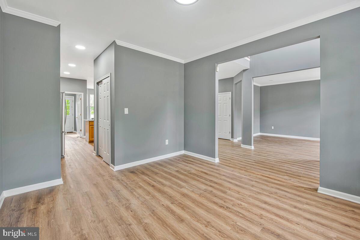 1329 Canberra Drive Baltimore, MD 21221 - Photo 8 of 43 a view of a hallway with wooden floor