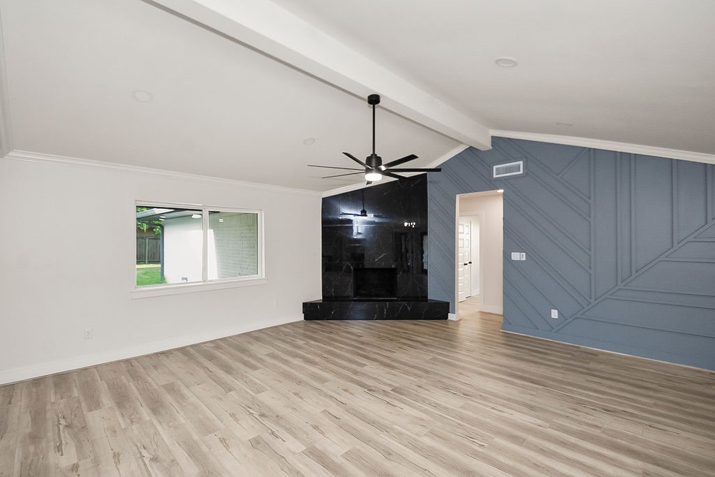 6106 Rutherglenn Drive Houston, TX 77096 - Photo 5 of 41 Spacious living room with dramatic vaulted ceilings and seamless flow into the entertaining spaces.