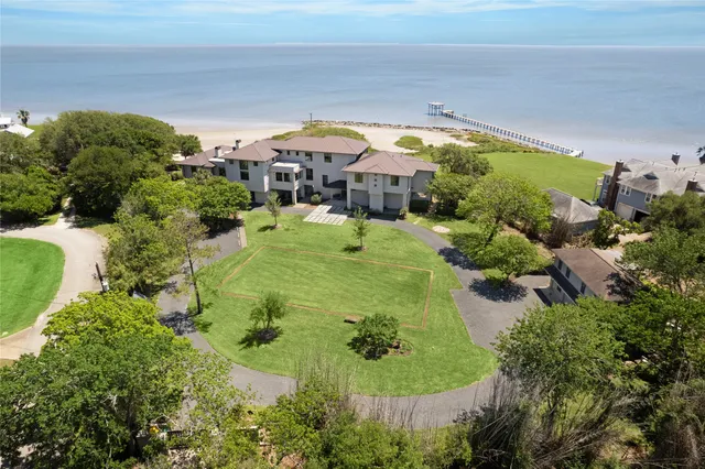 a swimming pool with outdoor seating and yard