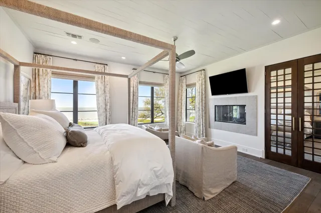 a white bath tub sitting next to a window