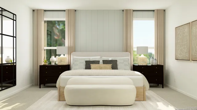 a bedroom with a large bed and a window