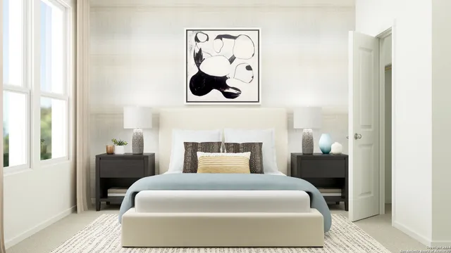 a bedroom with a bed and painting on the wall