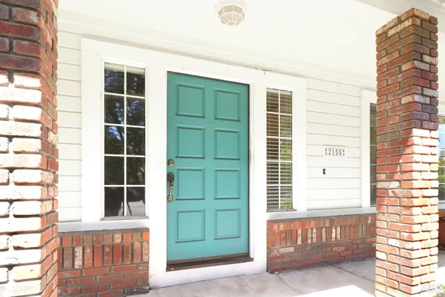 a front view of a house with a large window