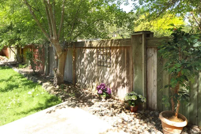 a backyard of a house with lots of green space