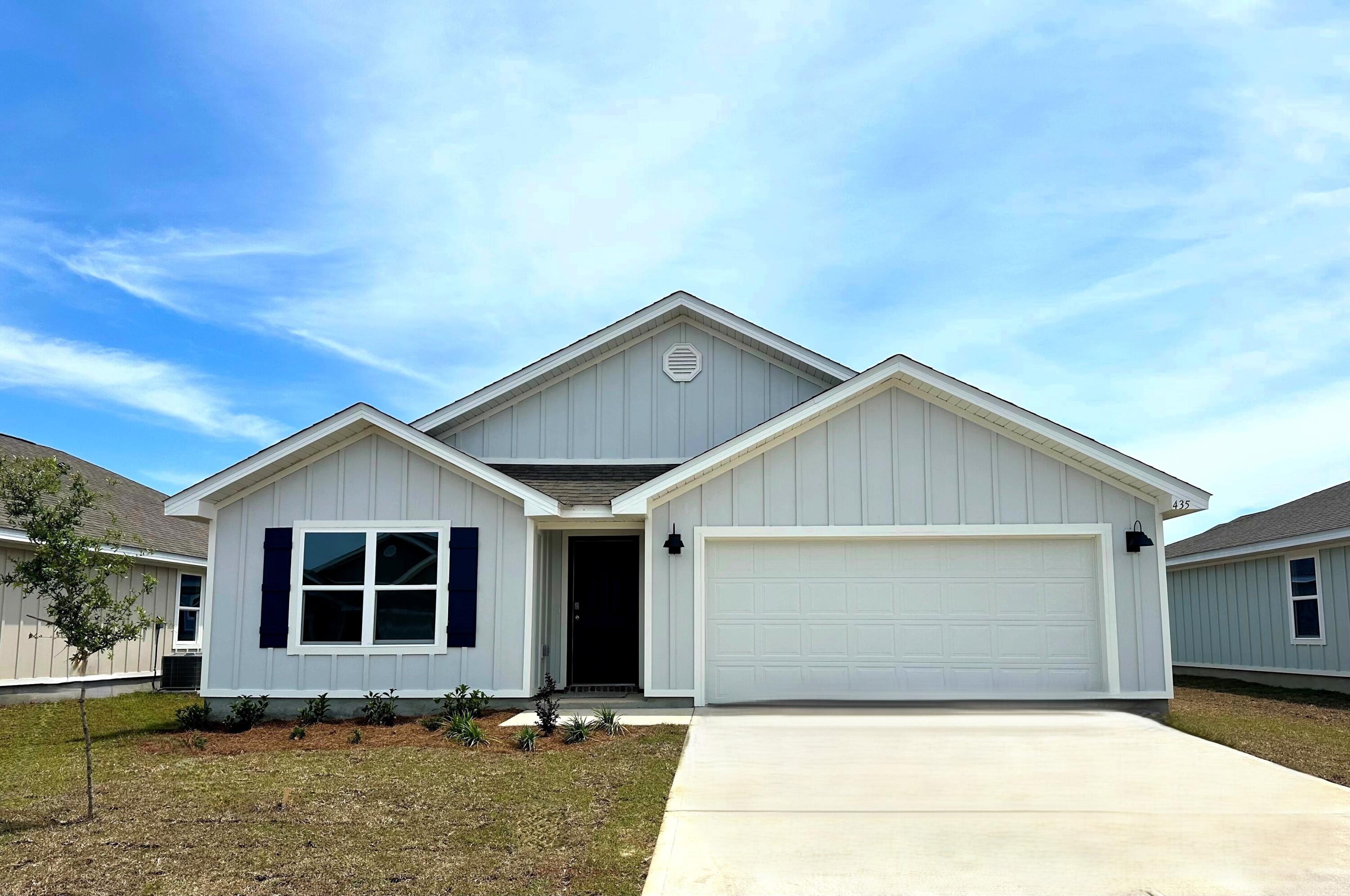 331 Flounder Street Crestview, FL 32539 - Photo 1 of 31 a front view of house with garage and yard