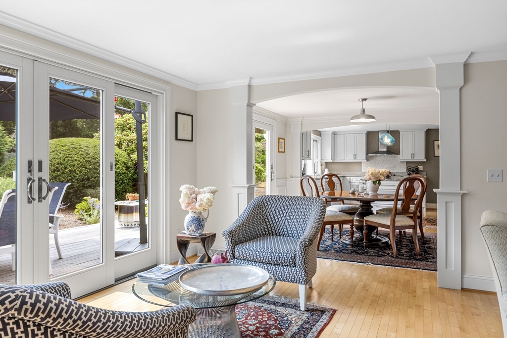 56 Riverview Drive Chatham, MA 02633 - Photo 11 of 37 a living room with furniture potted plant and a large window