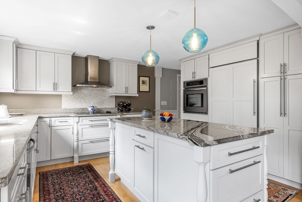 56 Riverview Drive Chatham, MA 02633 - Photo 14 of 37 a kitchen with stainless steel appliances granite countertop a stove a sink and a refrigerator