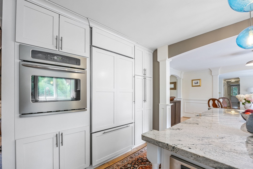 56 Riverview Drive Chatham, MA 02633 - Photo 17 of 37 a kitchen with granite countertop cabinets and refrigerator
