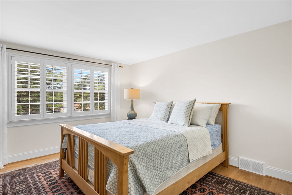 56 Riverview Drive Chatham, MA 02633 - Photo 18 of 37 a spacious bedroom with a bed and a window