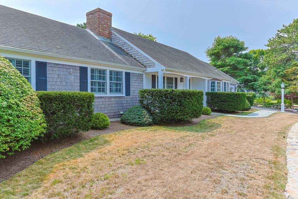 56 Riverview Drive Chatham, MA 02633 - Photo 2 of 37 a front view of a house with garden