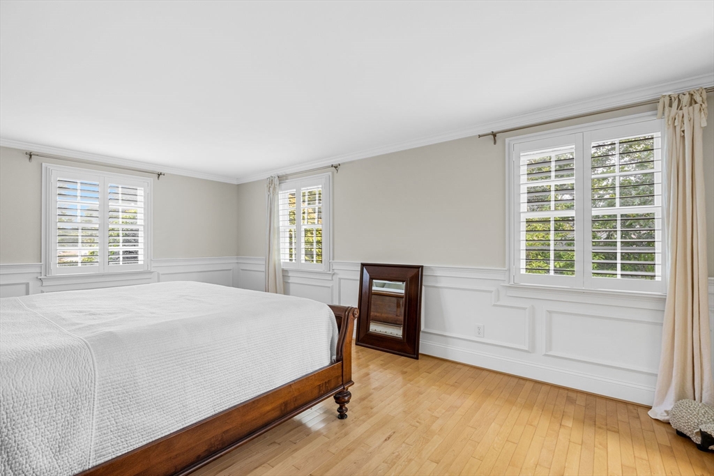 56 Riverview Drive Chatham, MA 02633 - Photo 21 of 37 a bedroom with a bed and a table in it with window