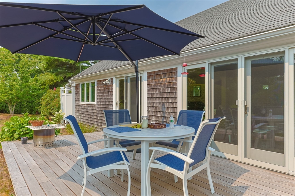 56 Riverview Drive Chatham, MA 02633 - Photo 31 of 37 a patio with a patio table and chairs