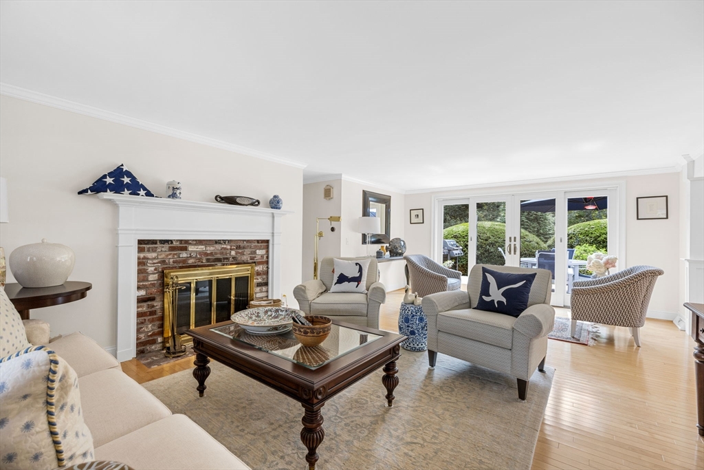 56 Riverview Drive Chatham, MA 02633 - Photo 5 of 37 a living room with furniture and a fireplace