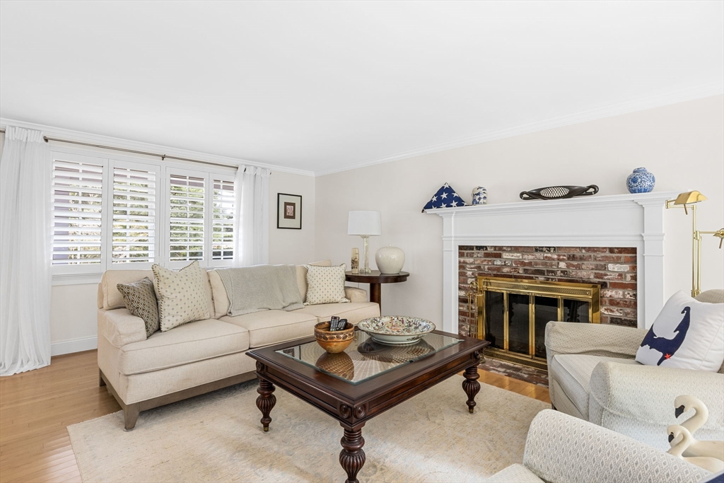 56 Riverview Drive Chatham, MA 02633 - Photo 7 of 37 a living room with furniture and a fireplace