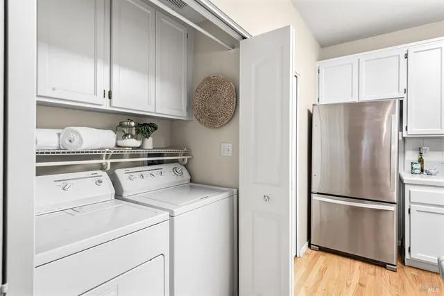 a kitchen with stainless steel appliances granite countertop a refrigerator sink and cabinets