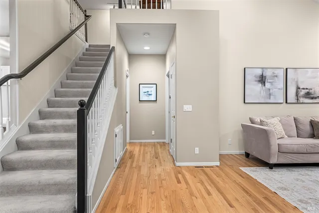 a view of a livingroom with furniture and stairs