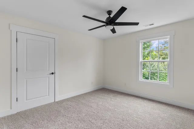 a picture of a bathroom with toilet and a shower