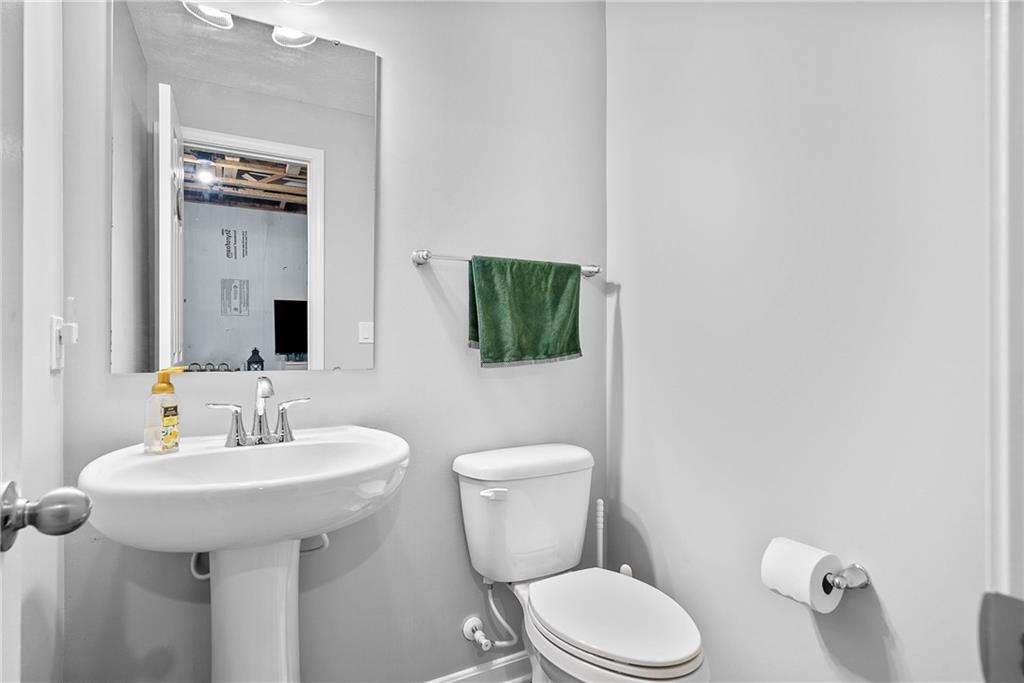 264 Lily Ridge Drive Canonsburg, PA 15317 - Photo 44 of 50 a bathroom with a toilet sink and mirror