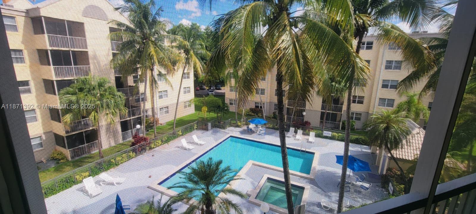 8323 Lake Drive, Unit 404 Doral, FL 33166 - Photo 11 of 11 a view of backyard with outdoor seating and city view
