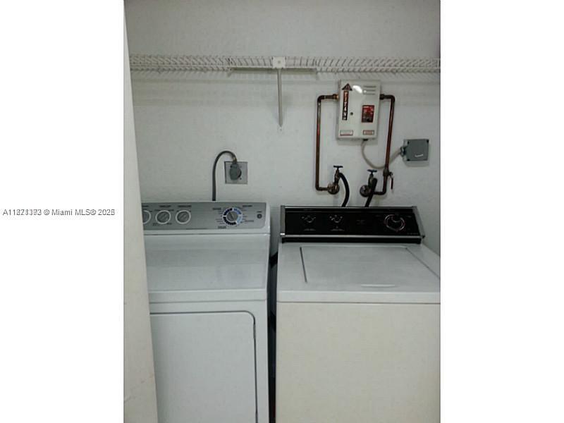 8323 Lake Drive, Unit 404 Doral, FL 33166 - Photo 8 of 11 a close view of washer and dryer